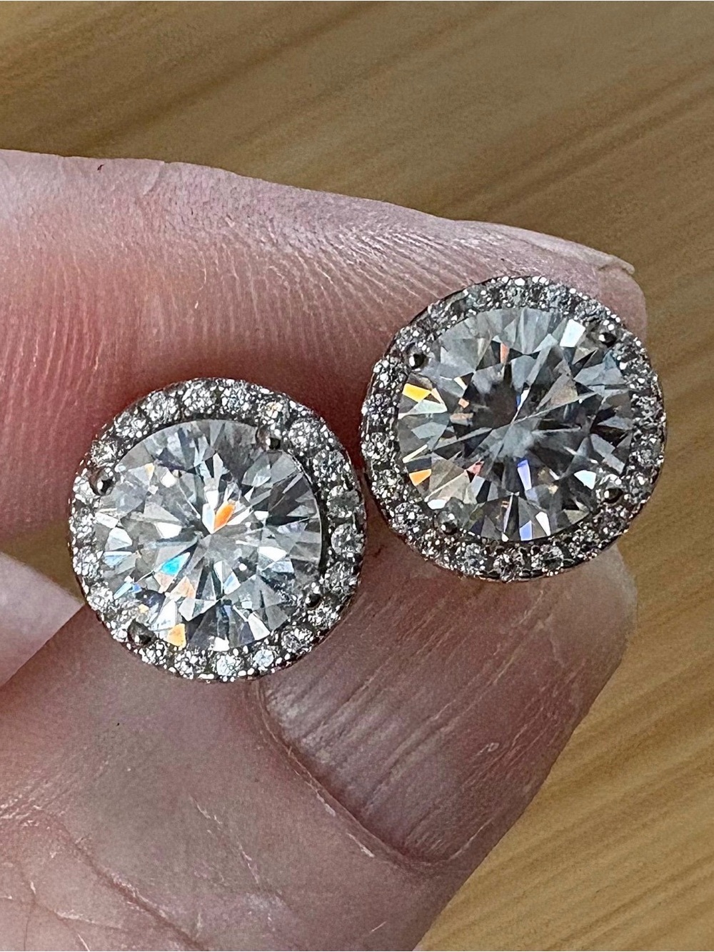 4ctw Moissanite studs with glistening zircon haloes in sterling silver!